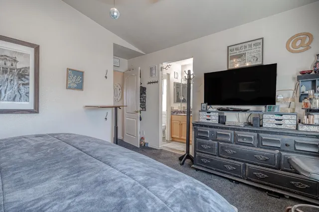 a spacious bathroom with a granite countertop sink mirror and toilet
