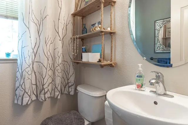 a bathroom with a toilet and a sink