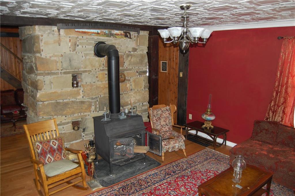 602 Hells Kitchen Road Polk, PA 16342 - Photo 6 of 22 Wood Burner - Living Room Area