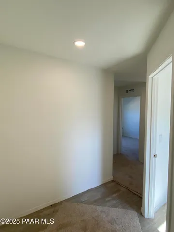 a view of a bathroom from a hallway