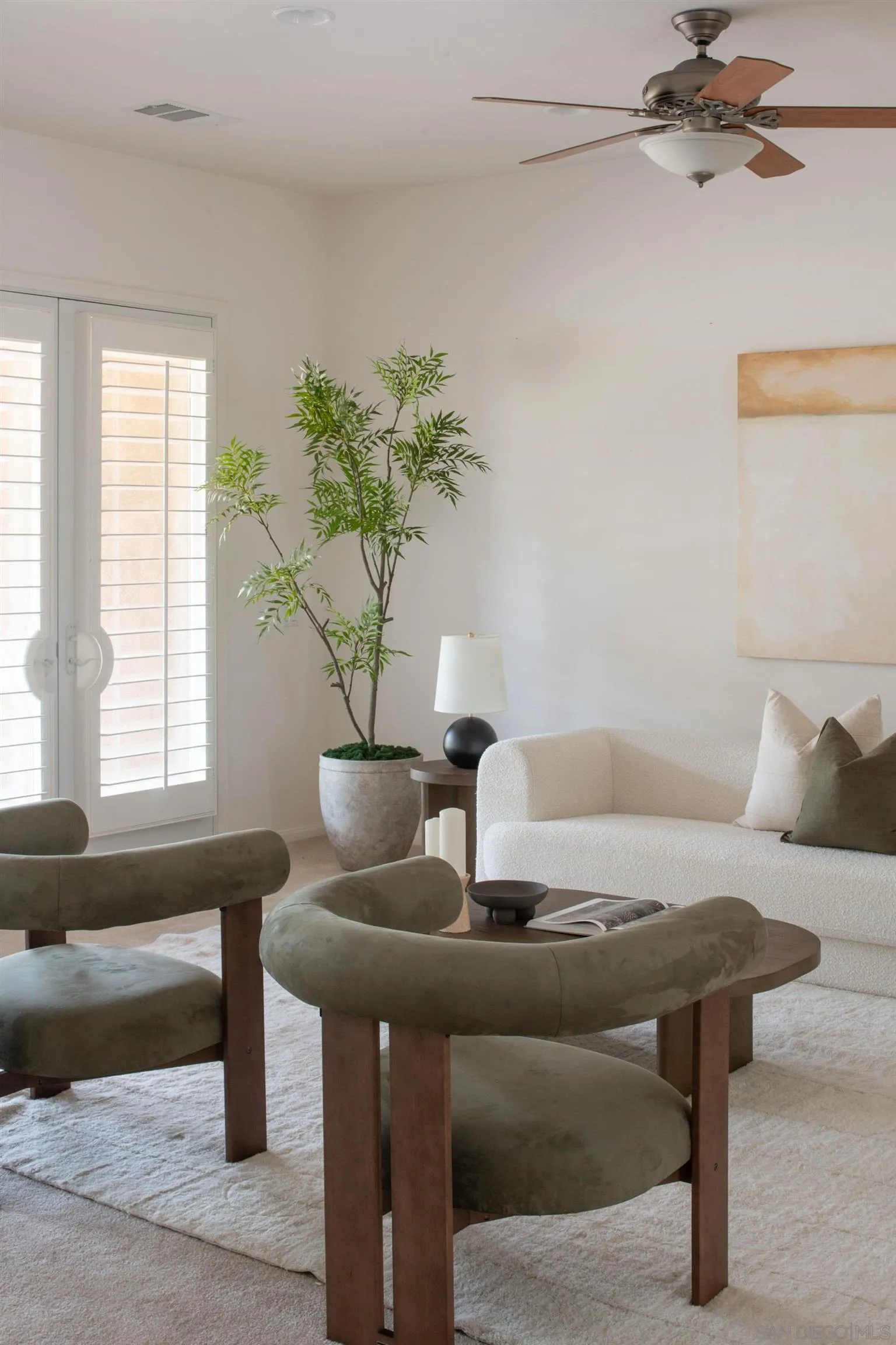 14220 Pebble Beach Way Valley Center, CA 92082 - Photo 11 of 48 a living room with furniture and a potted plant