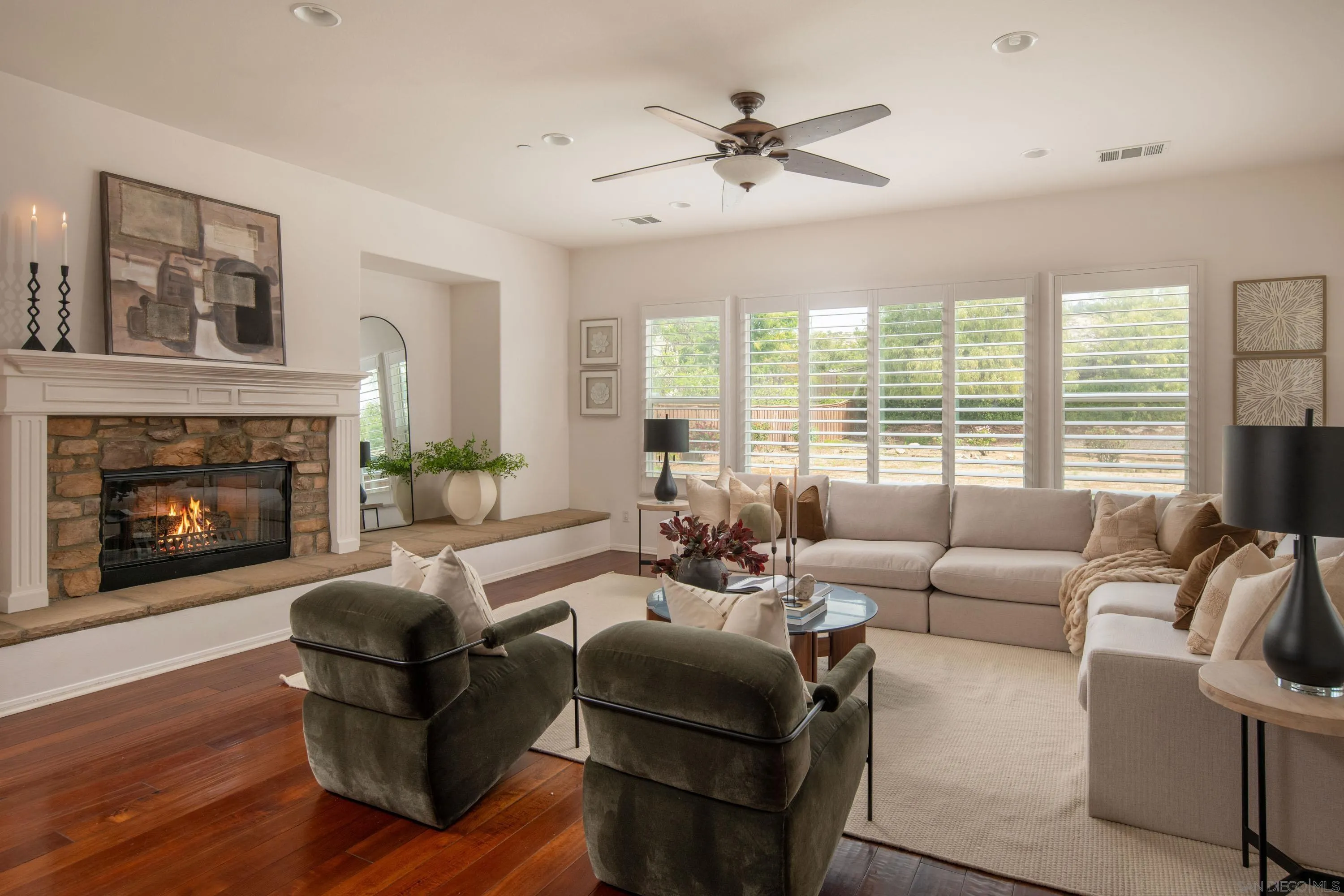14220 Pebble Beach Way Valley Center, CA 92082 - Photo 2 of 48 a living room with furniture fireplace and a large window