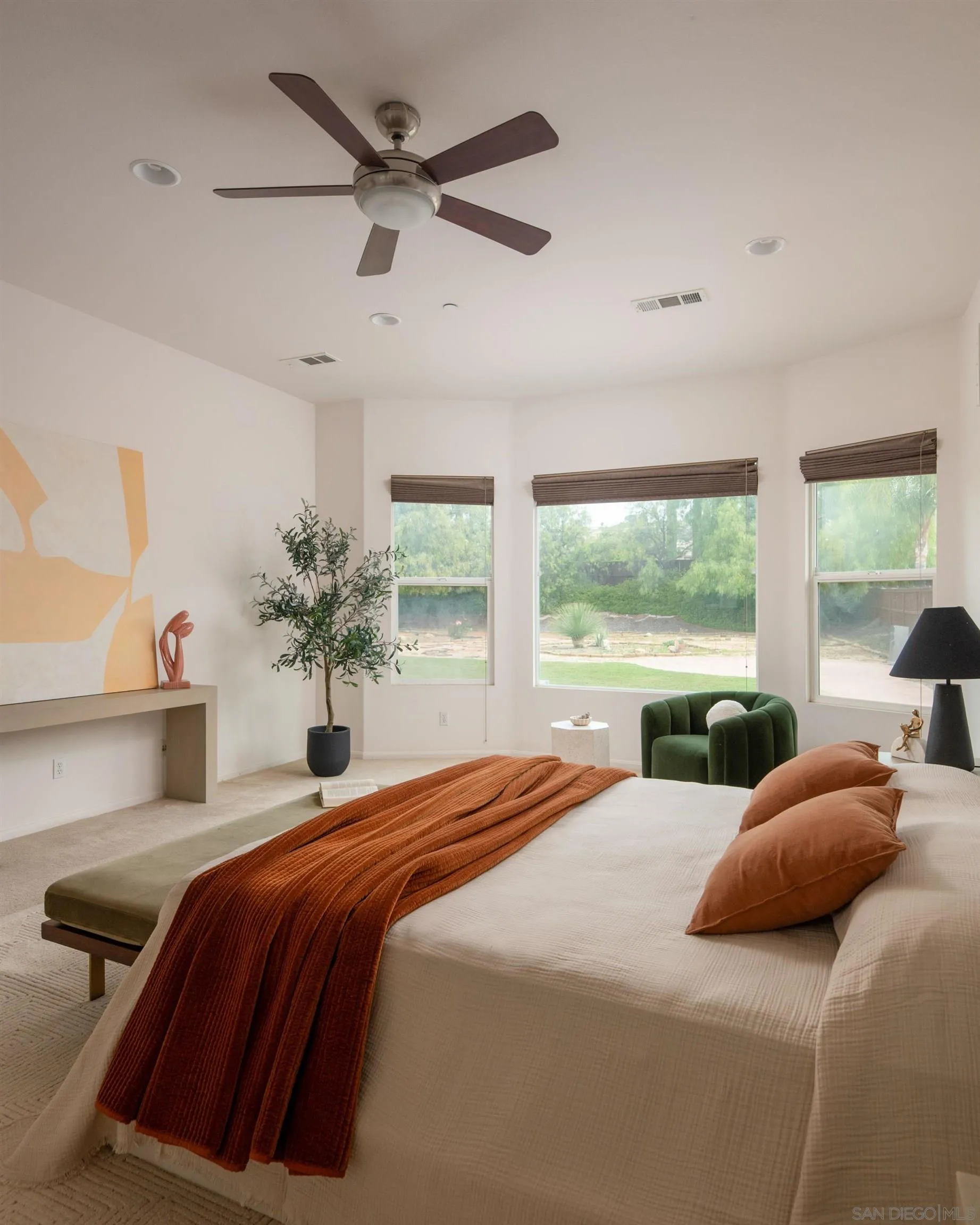 14220 Pebble Beach Way Valley Center, CA 92082 - Photo 21 of 48 a bedroom with a large bed and a large window