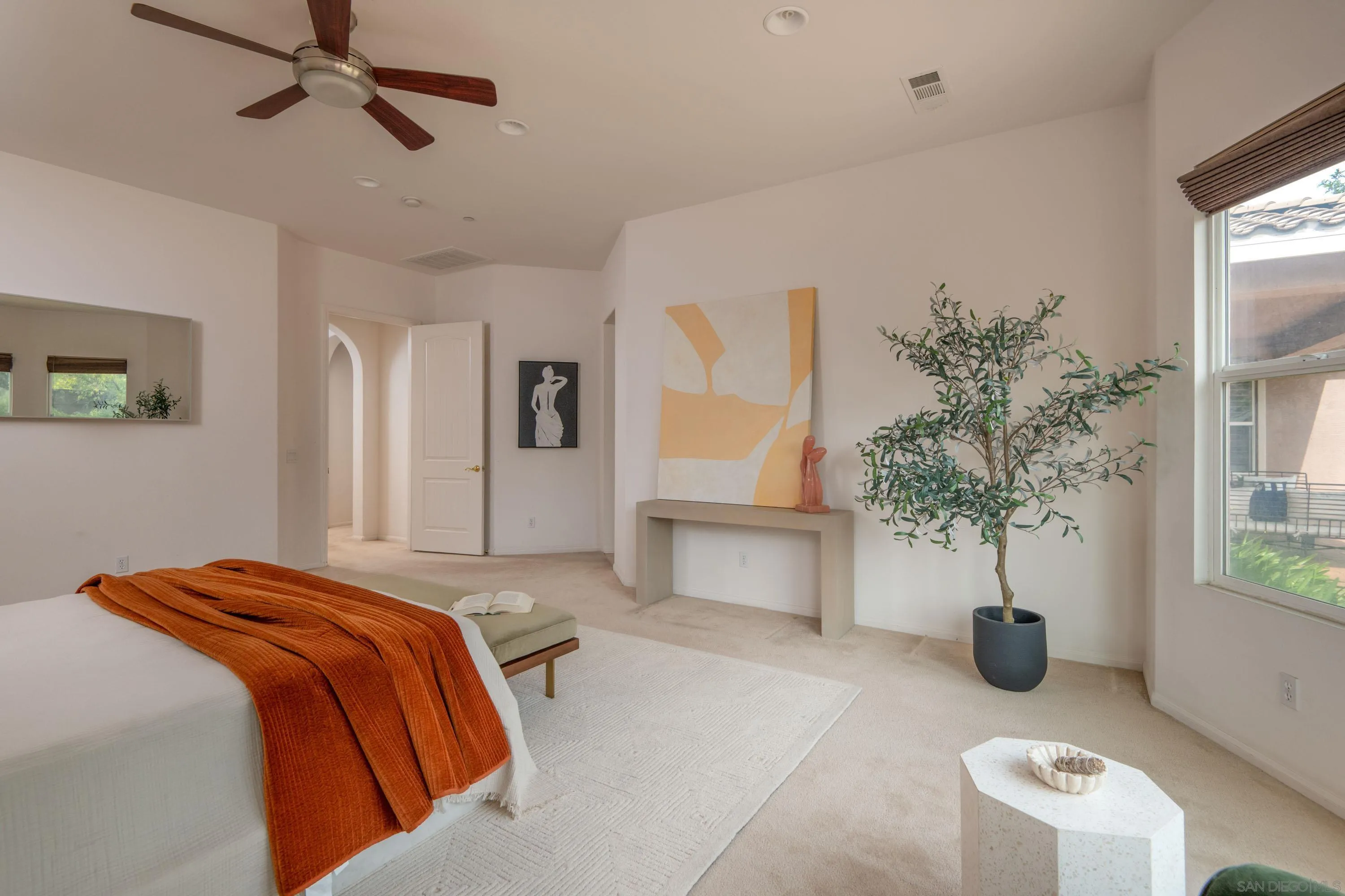14220 Pebble Beach Way Valley Center, CA 92082 - Photo 22 of 48 a bedroom with bed and a potted plant