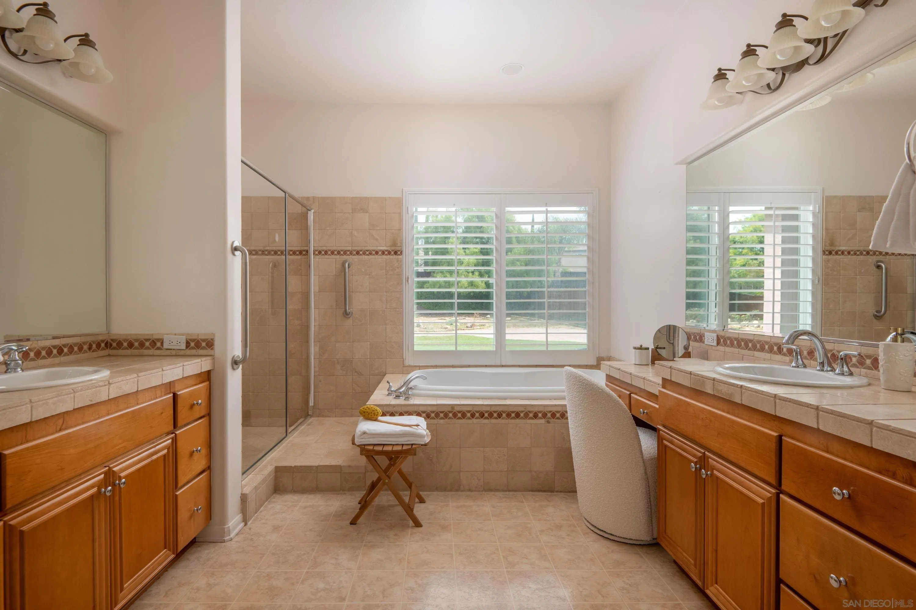 14220 Pebble Beach Way Valley Center, CA 92082 - Photo 25 of 48 a bathroom with a granite countertop sink a toilet and bathtub