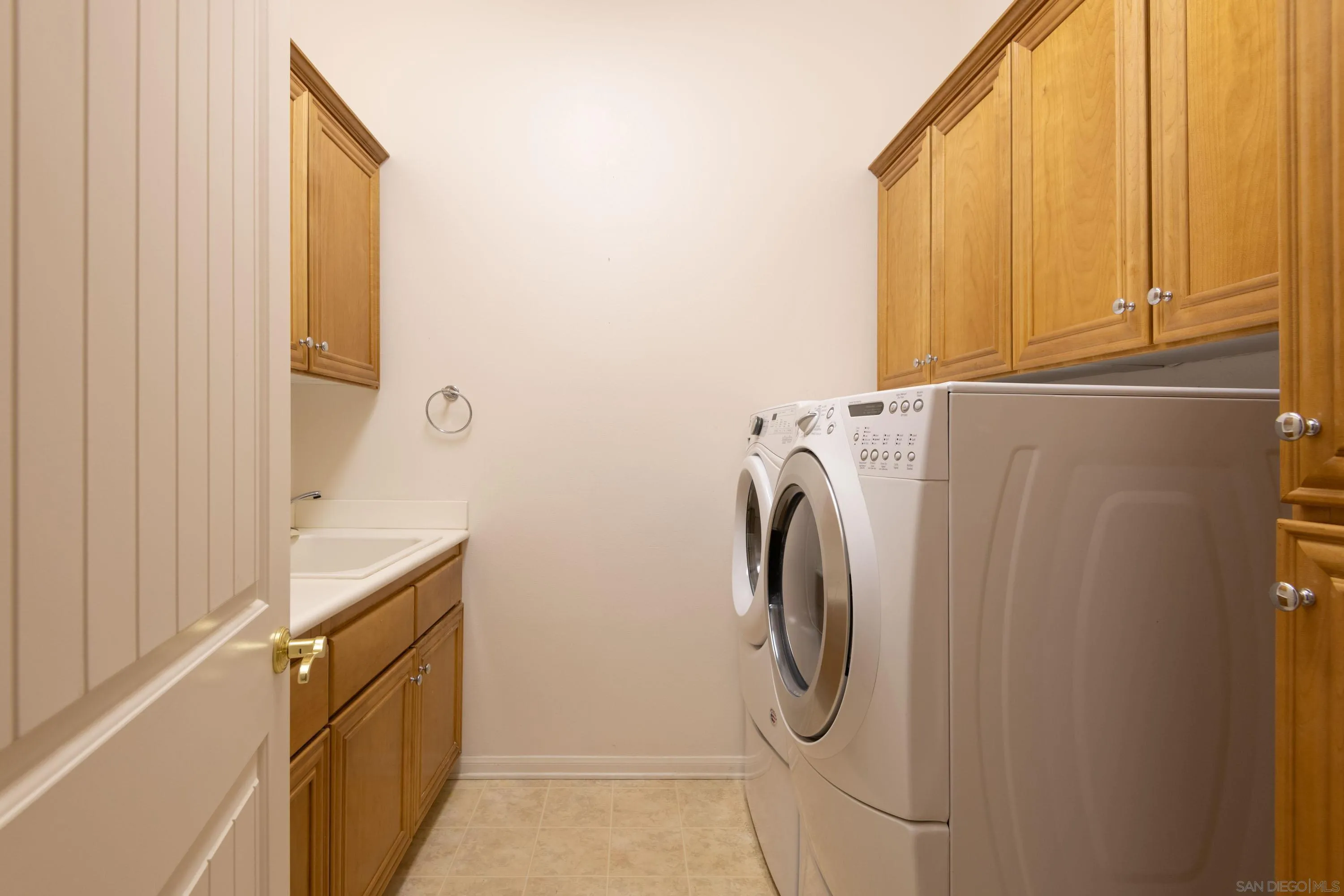 14220 Pebble Beach Way Valley Center, CA 92082 - Photo 28 of 48 a utility room with dryer and washer