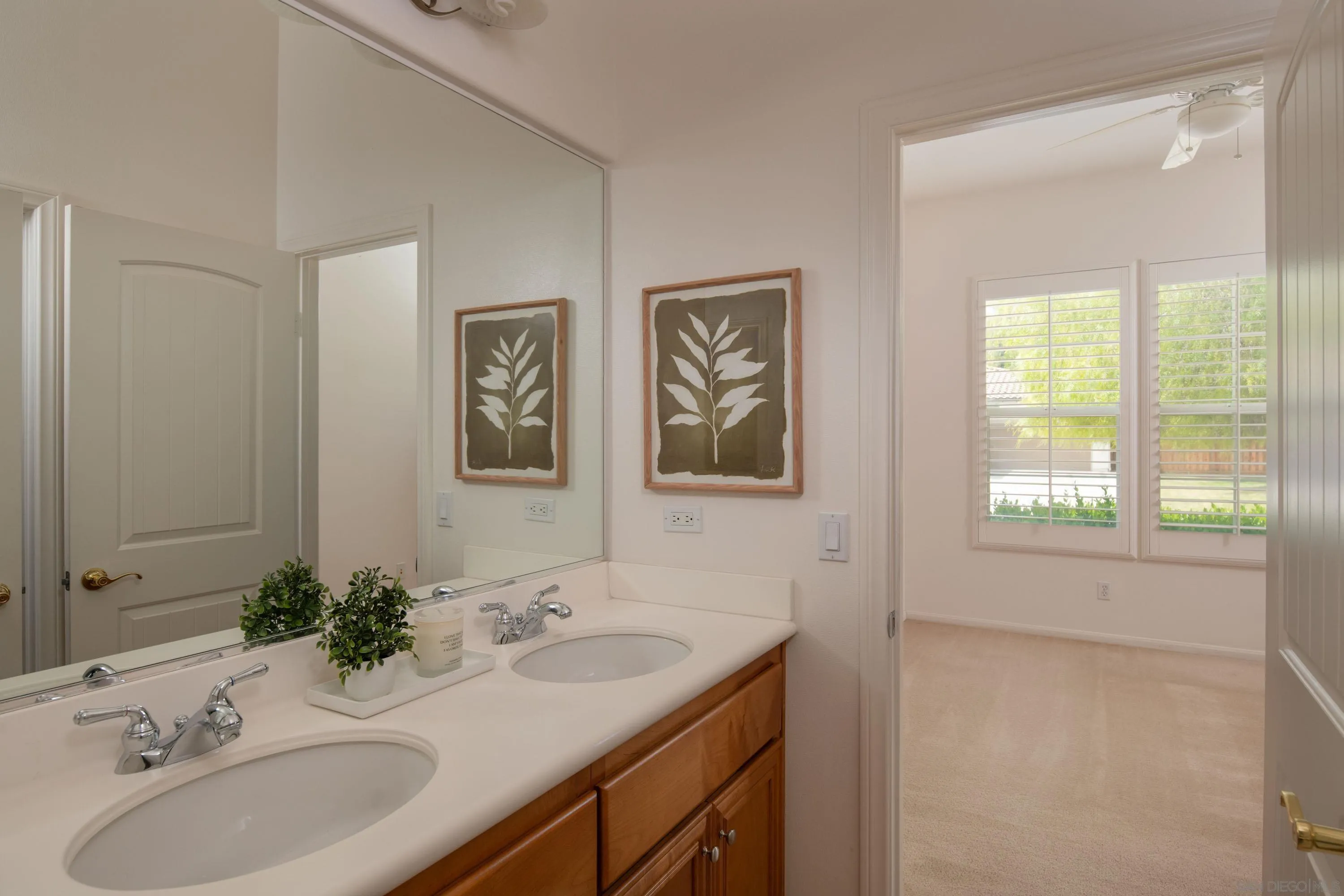 14220 Pebble Beach Way Valley Center, CA 92082 - Photo 29 of 48 a bathroom with 2 sink and a mirror