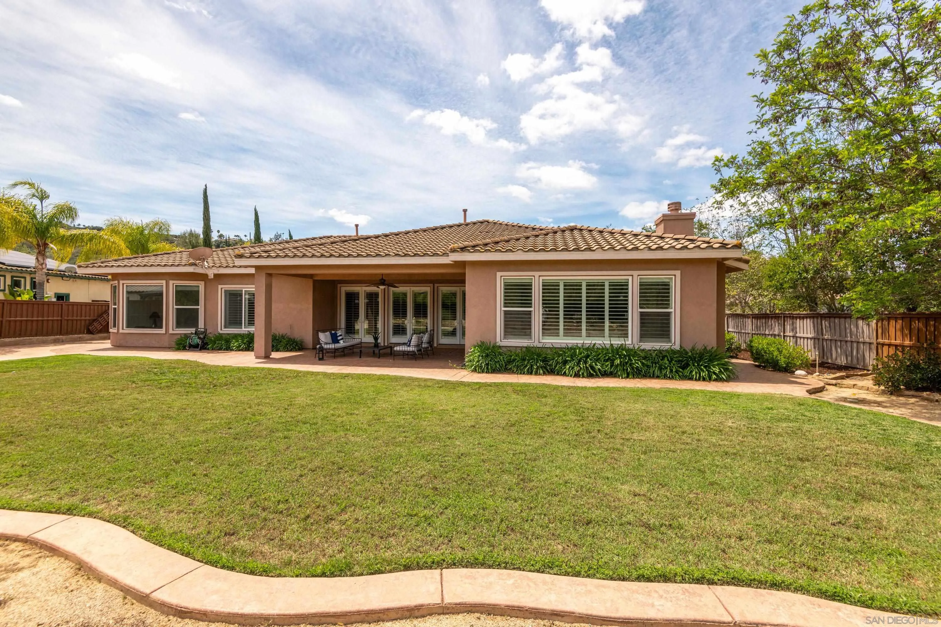 14220 Pebble Beach Way Valley Center, CA 92082 - Photo 35 of 48 a view of a house with a swimming pool