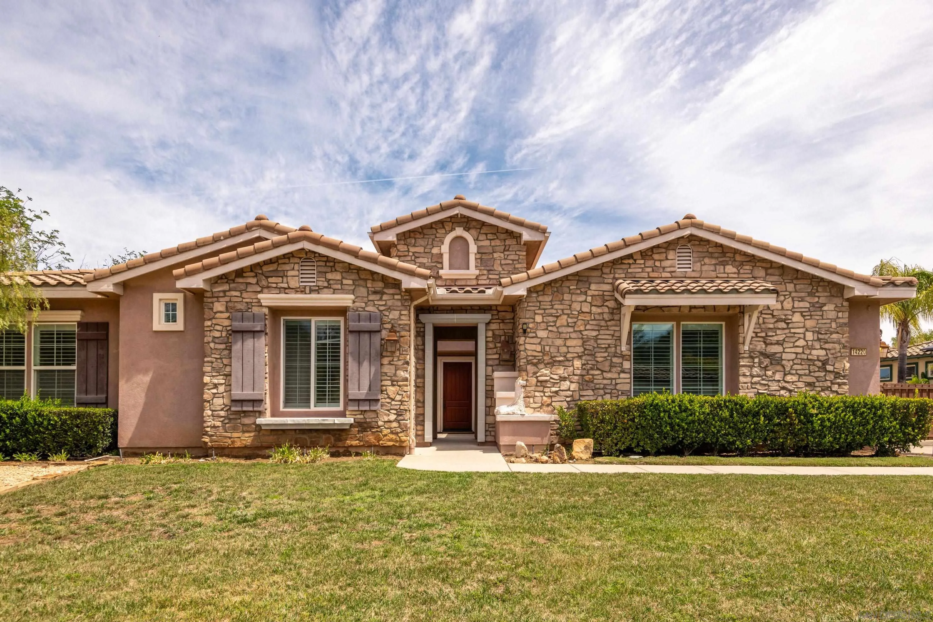 14220 Pebble Beach Way Valley Center, CA 92082 - Photo 36 of 48 front view of a house with a yard