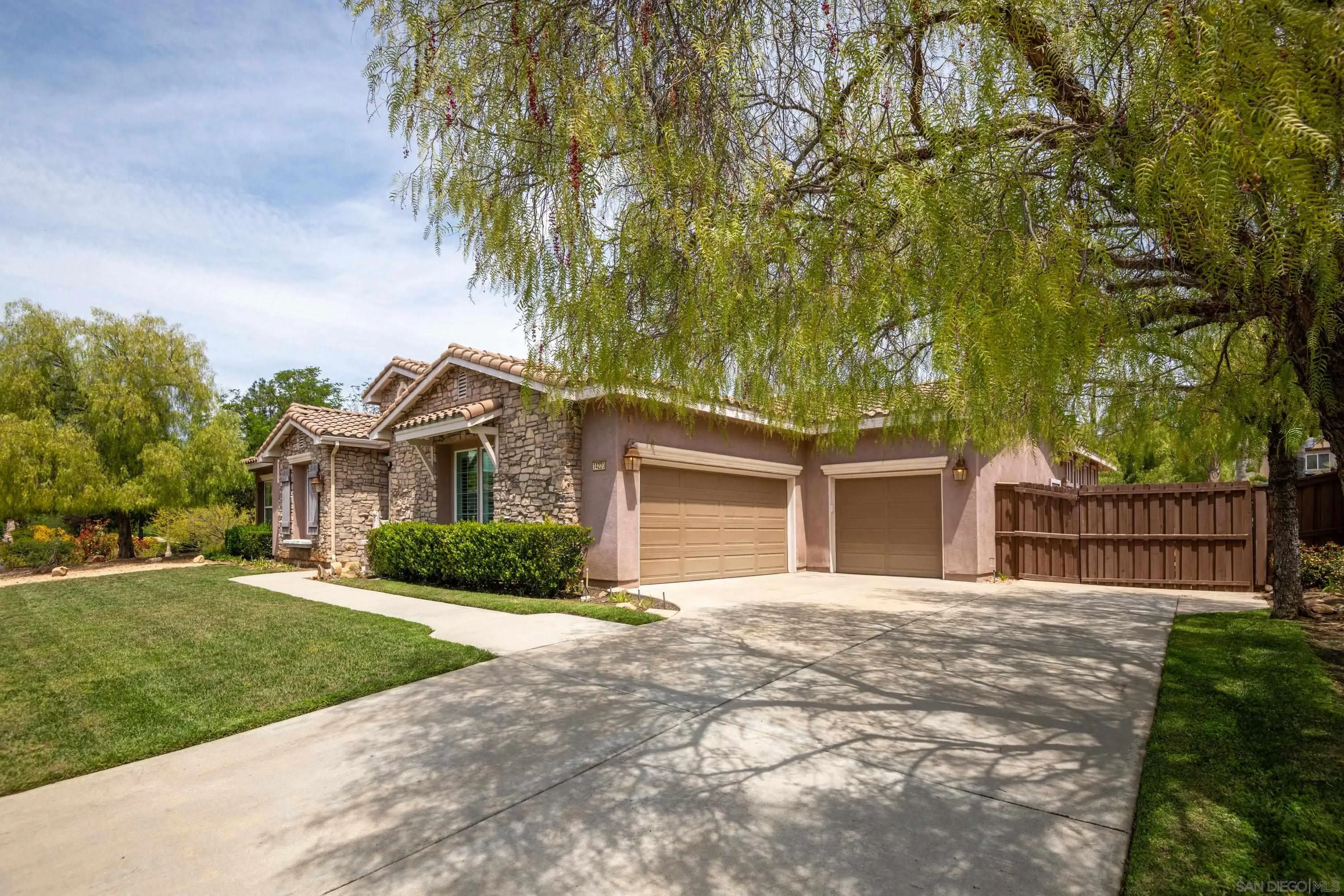 14220 Pebble Beach Way Valley Center, CA 92082 - Photo 37 of 48 front view of a house with a yard