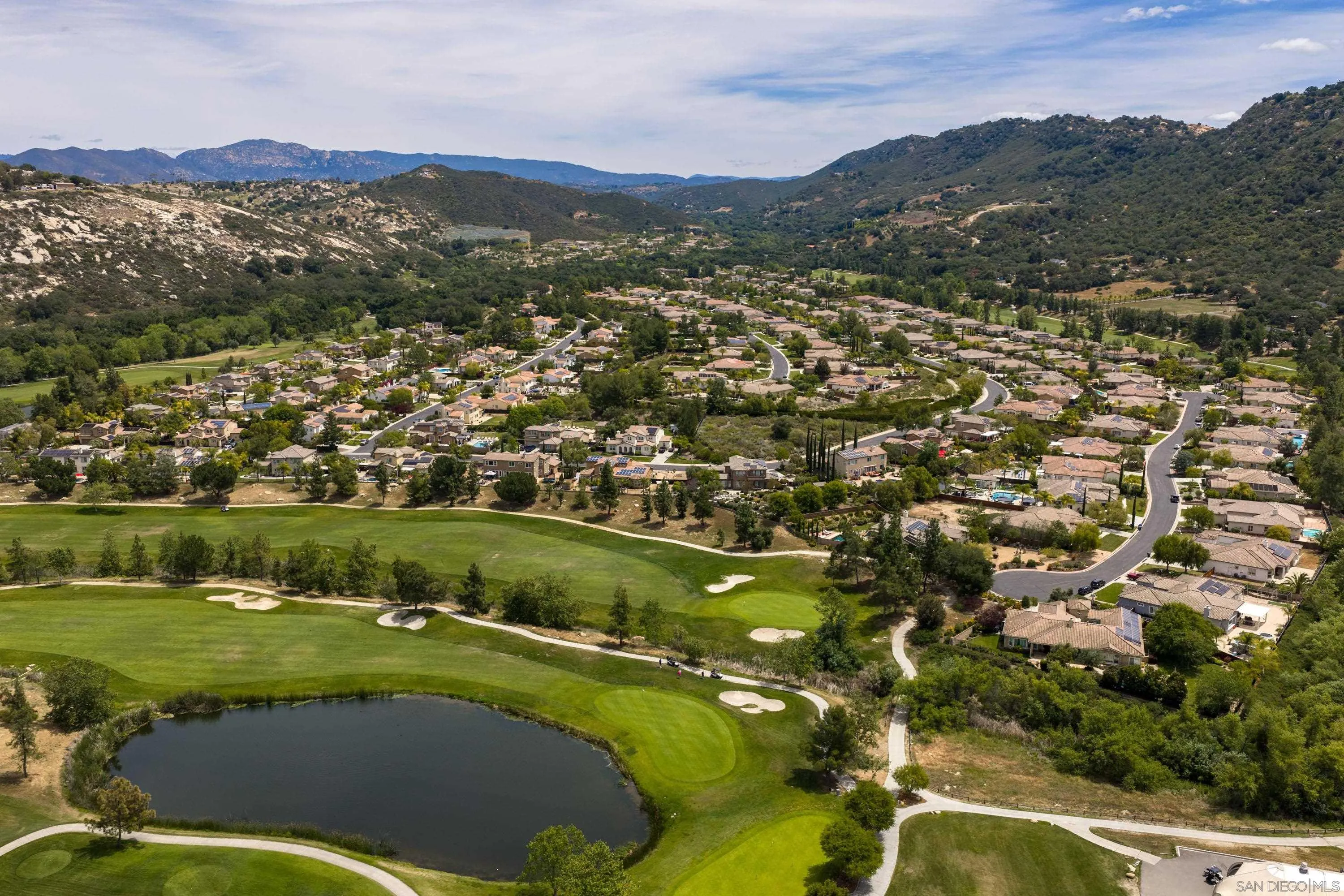 14220 Pebble Beach Way Valley Center, CA 92082 - Photo 43 of 48 a view of a city with mountains in the background