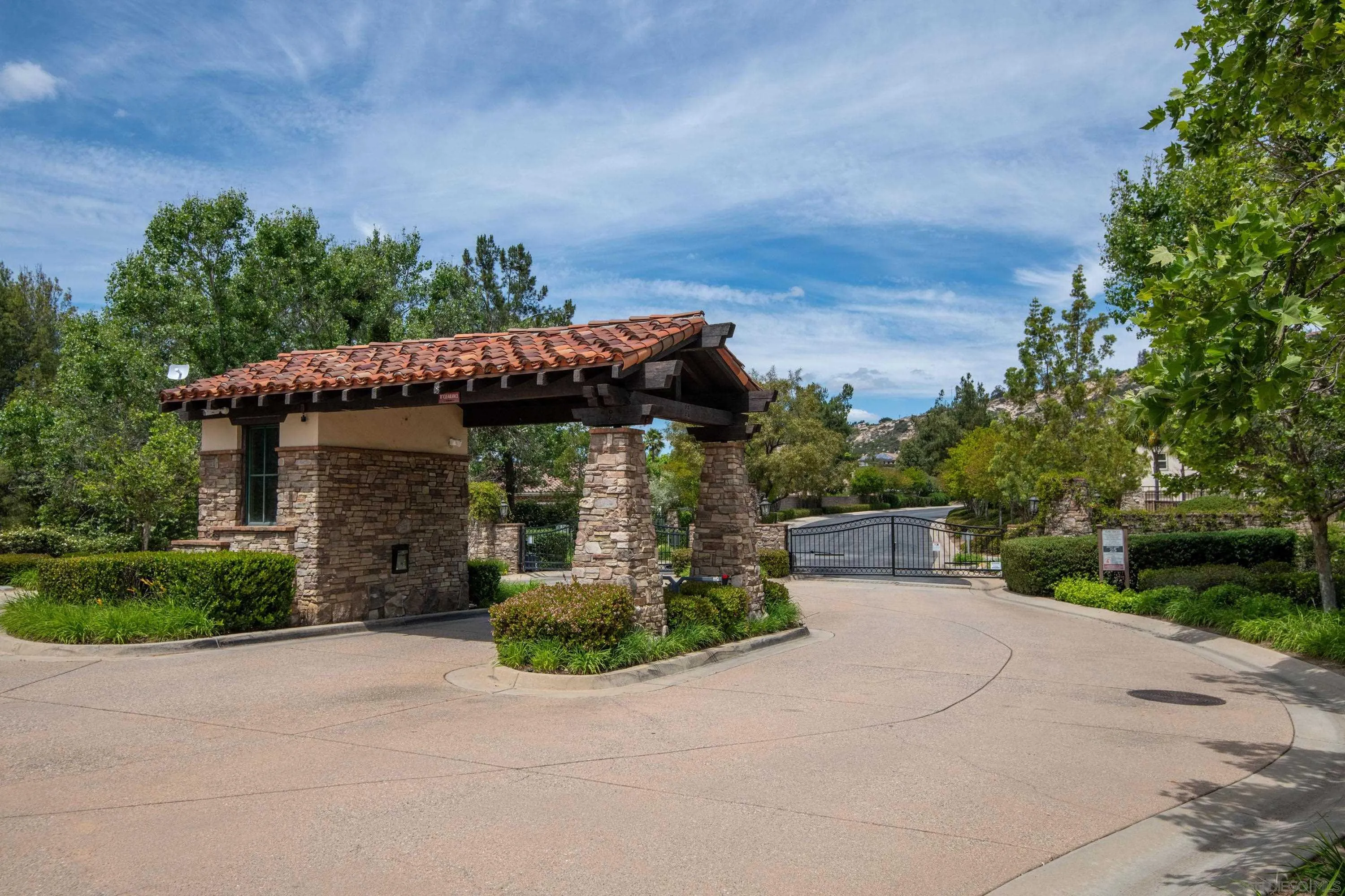 14220 Pebble Beach Way Valley Center, CA 92082 - Photo 48 of 48 a view of a house with potted plants and large trees