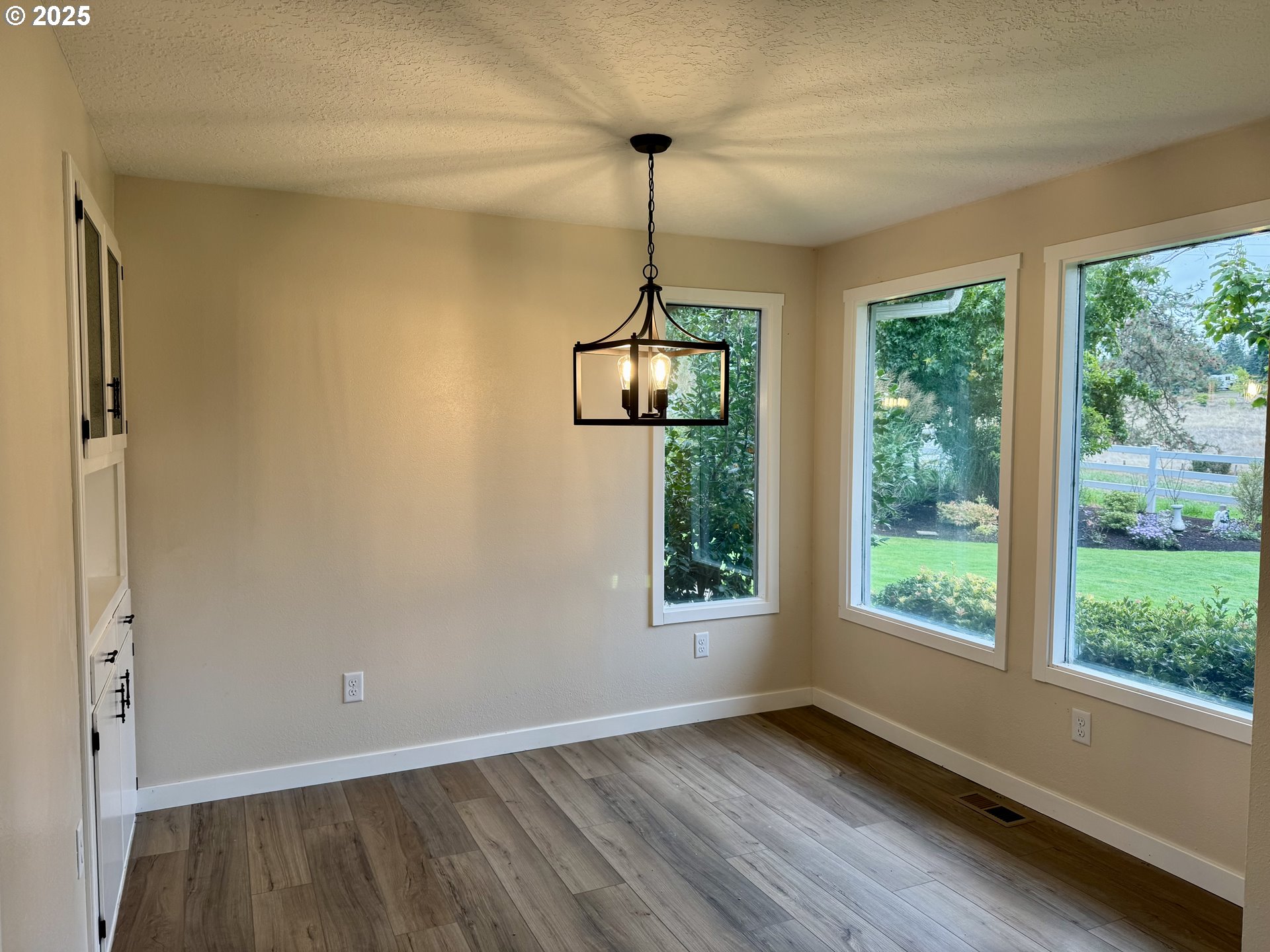 35929 Enterprise Road Creswell, OR 97426 - Photo 21 of 48 a view of empty room with wooden floor and fan