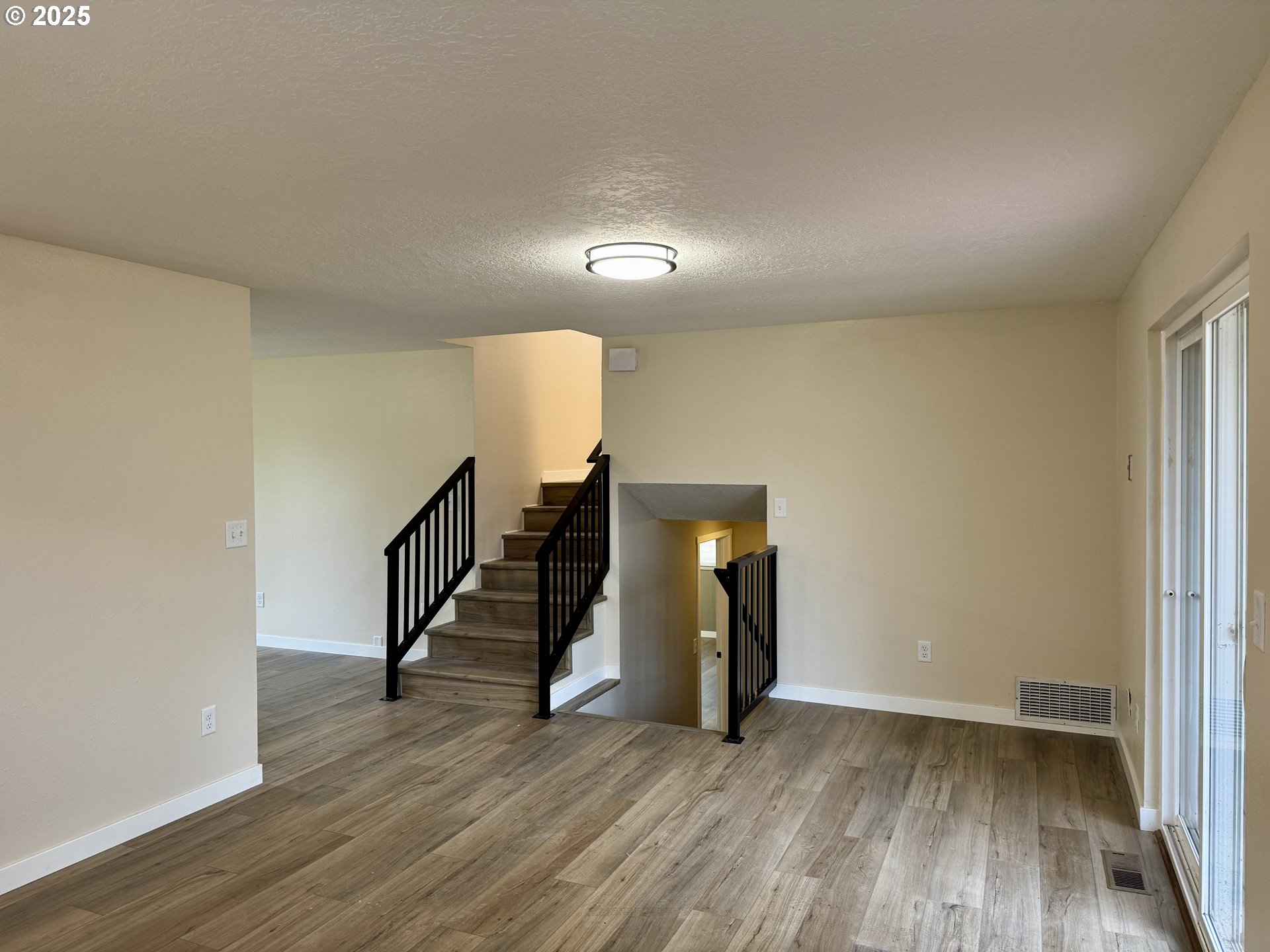 35929 Enterprise Road Creswell, OR 97426 - Photo 32 of 48 a view of an empty room with wooden floor