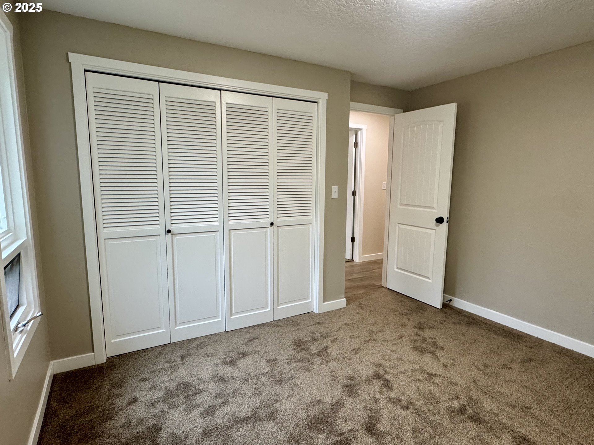 35929 Enterprise Road Creswell, OR 97426 - Photo 38 of 48 an empty room with a wooden door