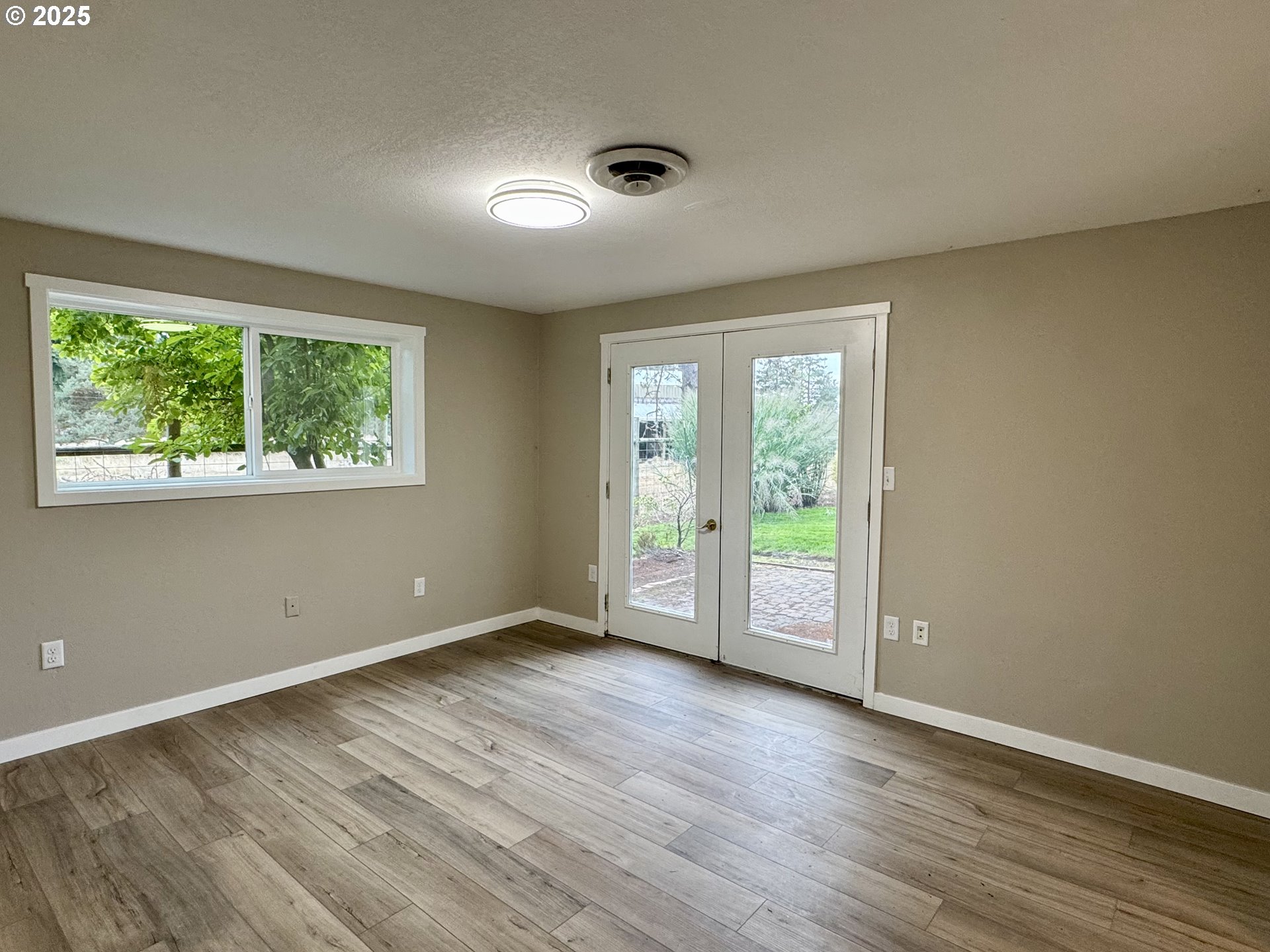 35929 Enterprise Road Creswell, OR 97426 - Photo 46 of 48 a view of an empty room with wooden floor and a window