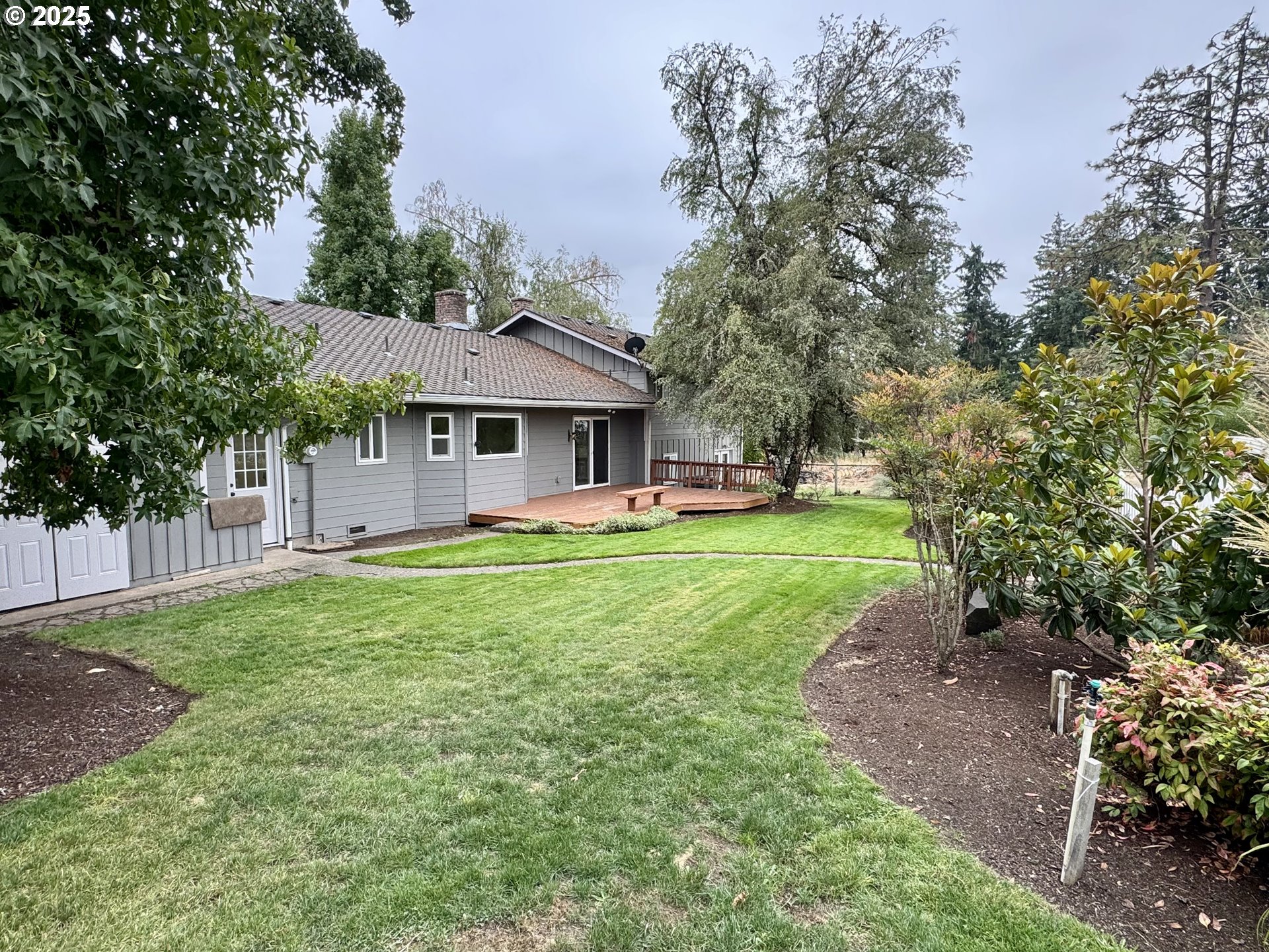 35929 Enterprise Road Creswell, OR 97426 - Photo 7 of 48 a front view of a house with a yard table and chairs
