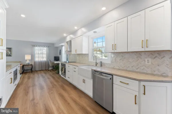 a kitchen with sink cabinets and window