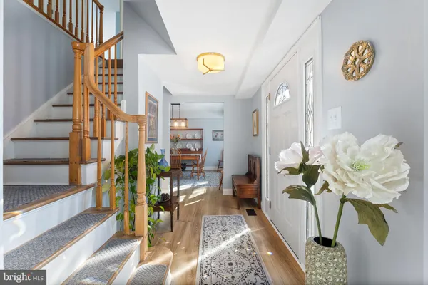 a view of living room with furniture and a potted plant