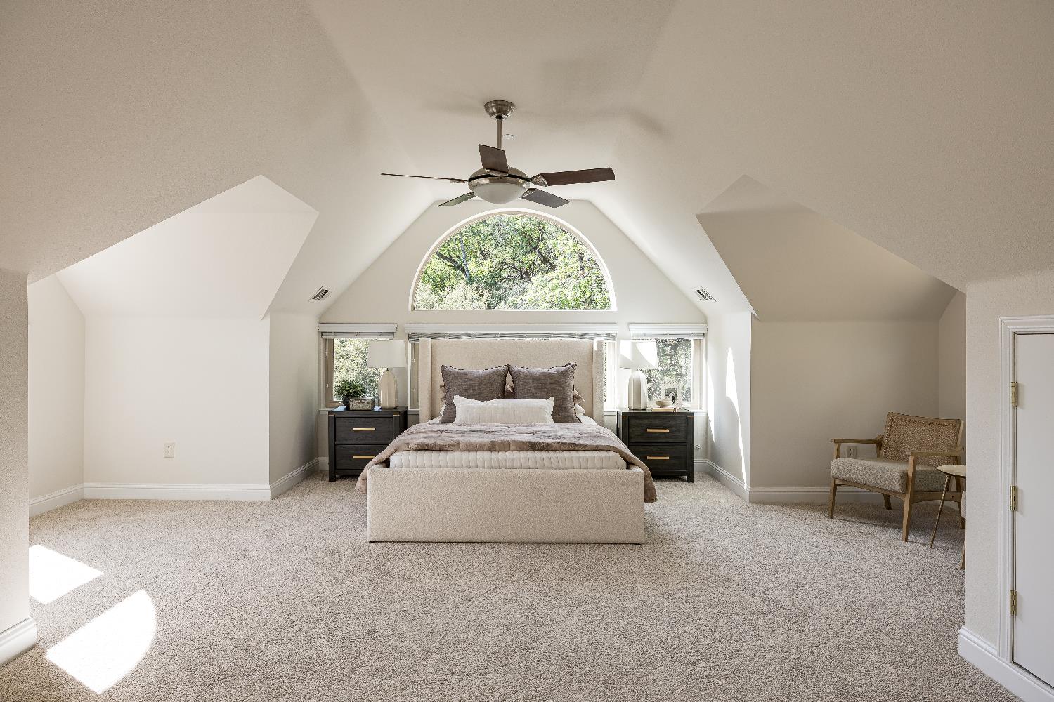 2213 Old Toll Road Placerville, CA 95667 - Photo 25 of 77 a bedroom with a bed and a chandelier