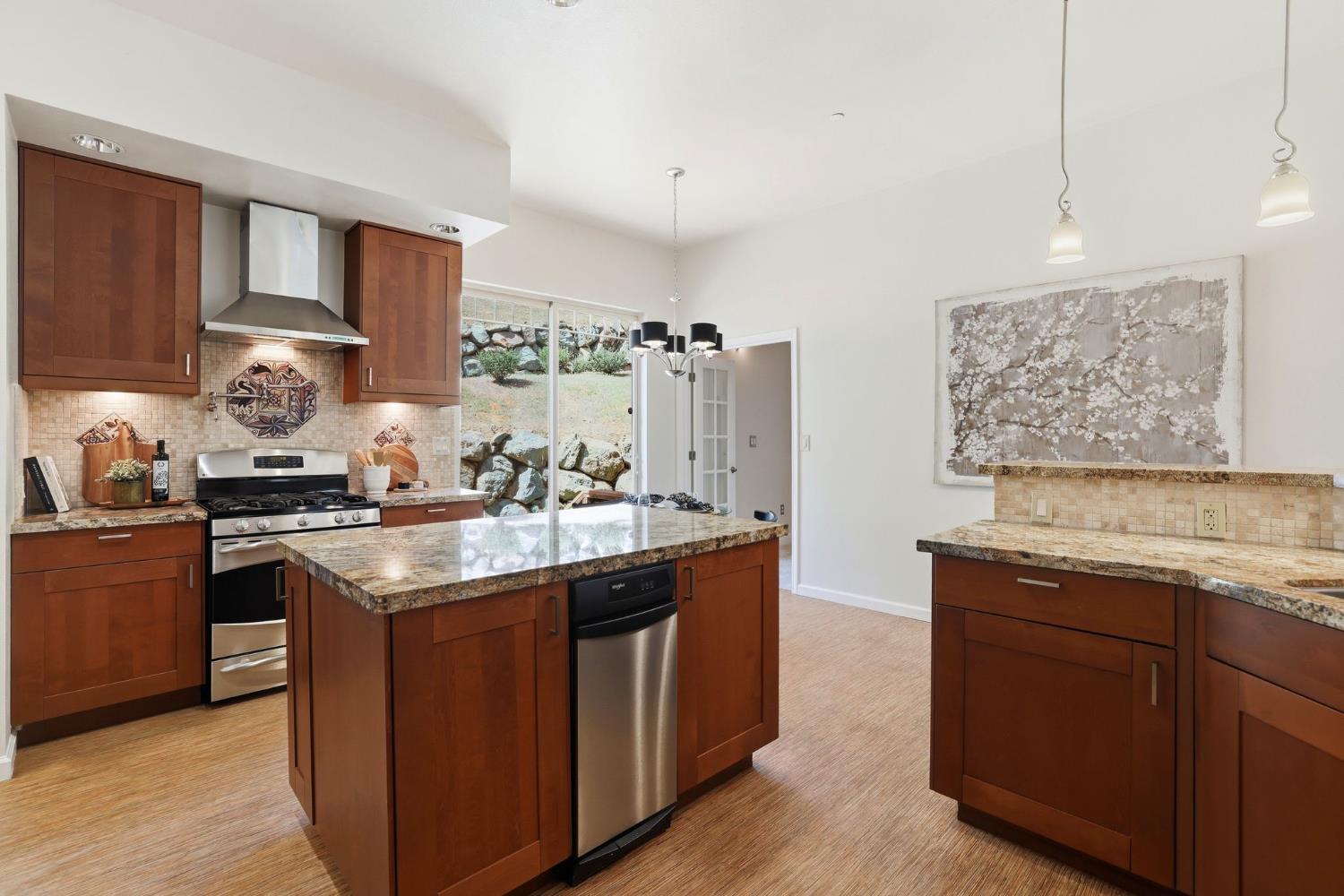 2213 Old Toll Road Placerville, CA 95667 - Photo 64 of 77 a kitchen with stainless steel appliances granite countertop a sink stove and cabinets
