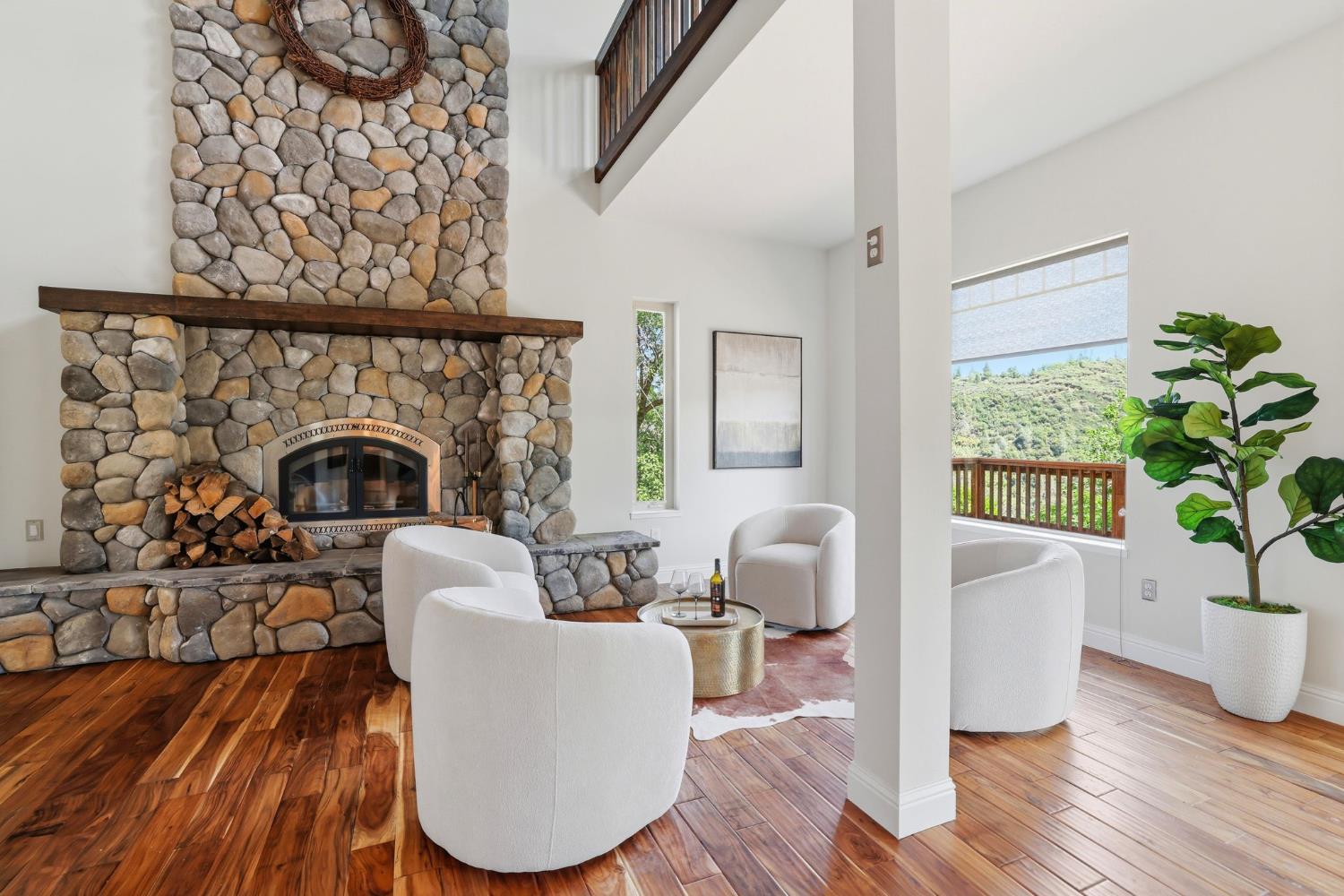 2213 Old Toll Road Placerville, CA 95667 - Photo 73 of 77 a living room with furniture a potted plant and a fireplace