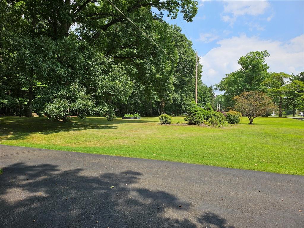 139 Sunset Road Grove City, PA 16127 - Photo 11 of 48 a view of a house with a big yard and palm trees