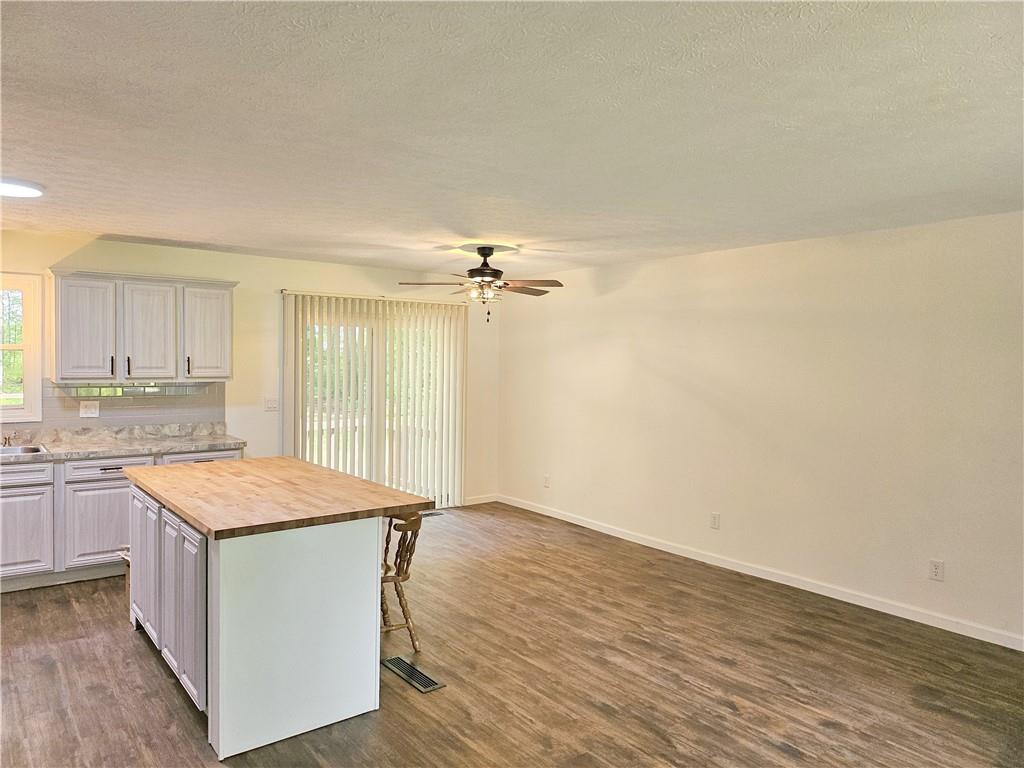 139 Sunset Road Grove City, PA 16127 - Photo 15 of 48 a kitchen with granite countertop a sink cabinets and wooden floor