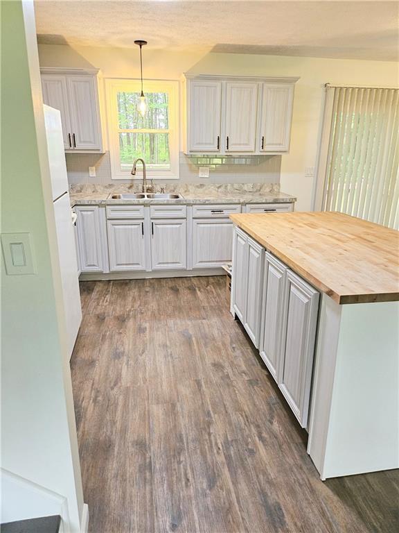 139 Sunset Road Grove City, PA 16127 - Photo 22 of 48 a kitchen with wooden floors and sink