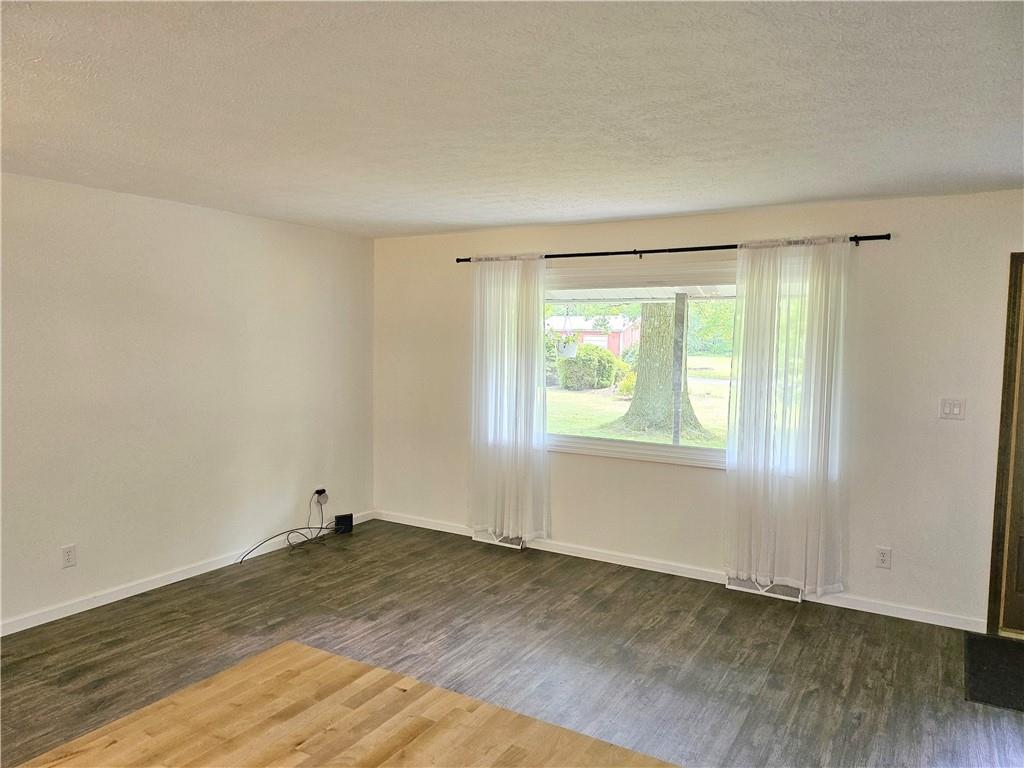 139 Sunset Road Grove City, PA 16127 - Photo 24 of 48 an empty room with wooden floor and windows