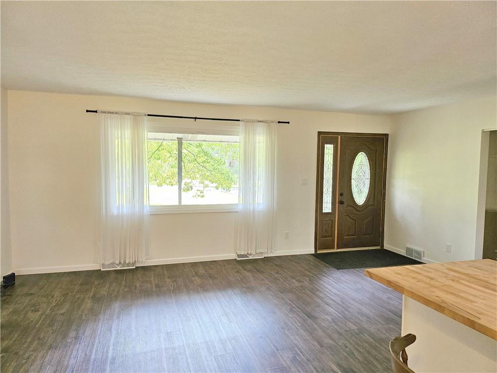 139 Sunset Road Grove City, PA 16127 - Photo 25 of 48 an empty room with wooden floor and windows
