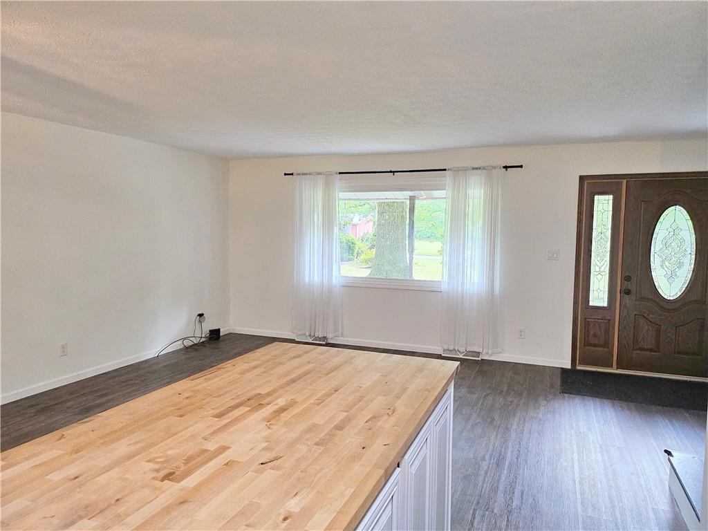 139 Sunset Road Grove City, PA 16127 - Photo 27 of 48 a view of an empty room with wooden floor and window