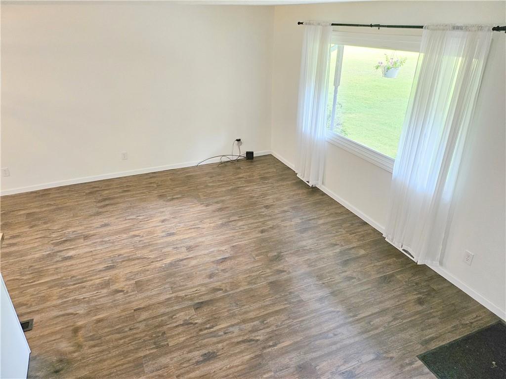 139 Sunset Road Grove City, PA 16127 - Photo 28 of 48 an empty room with wooden floor and windows