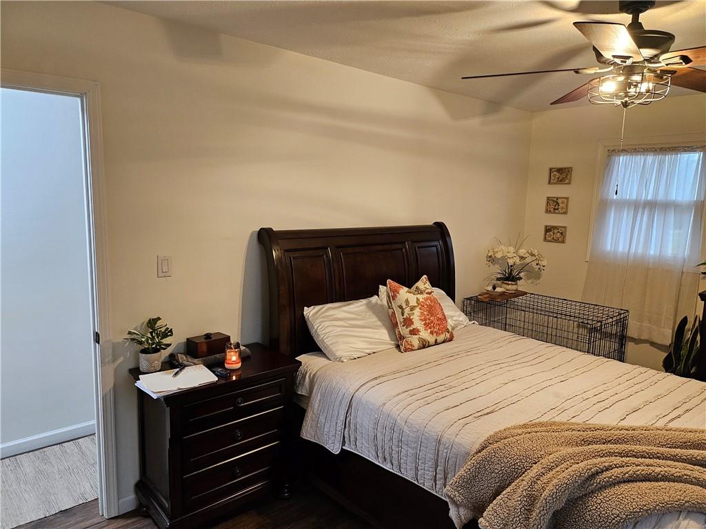 139 Sunset Road Grove City, PA 16127 - Photo 31 of 48 a bedroom with a bed and a chandelier