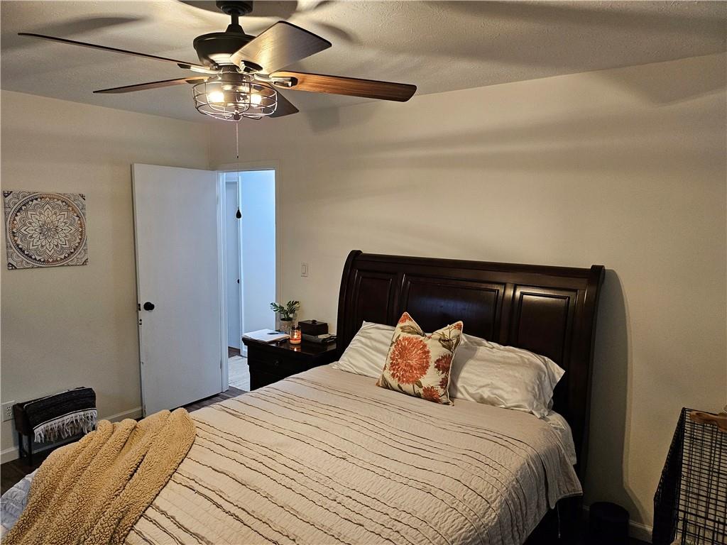 139 Sunset Road Grove City, PA 16127 - Photo 32 of 48 a bedroom with a bed and a chandelier