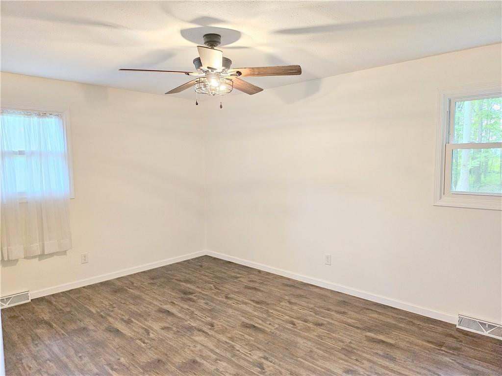 139 Sunset Road Grove City, PA 16127 - Photo 34 of 48 a view of a room with wooden floor and fan