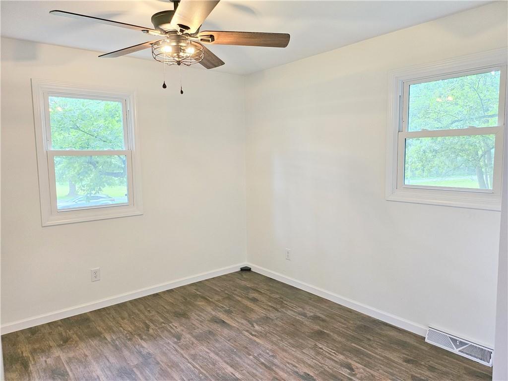 139 Sunset Road Grove City, PA 16127 - Photo 35 of 48 an empty room with a window and a fan