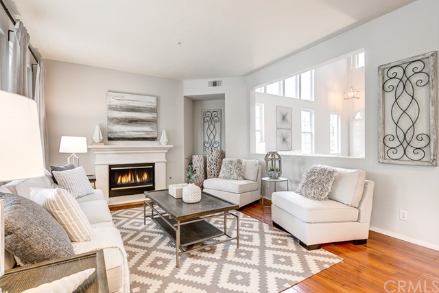 24 Silveroak Irvine, CA 92620 - Photo 15 of 49 a living room with furniture and a fireplace