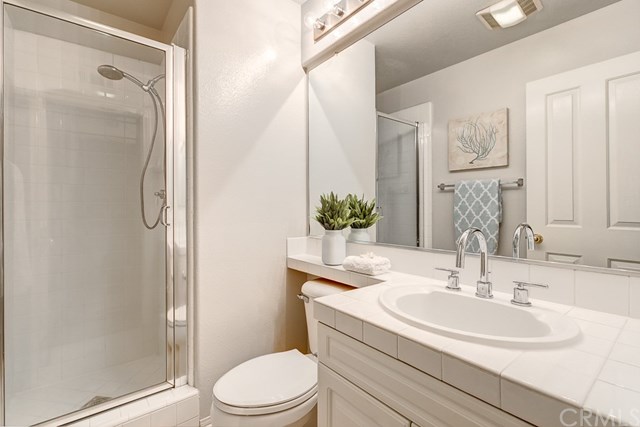 24 Silveroak Irvine, CA 92620 - Photo 22 of 49 a bathroom with a sink a toilet and shower