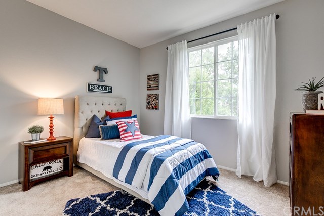 24 Silveroak Irvine, CA 92620 - Photo 29 of 49 a bedroom with a bed and a window