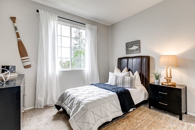 24 Silveroak Irvine, CA 92620 - Photo 31 of 49 a bedroom with a bed and a window