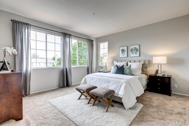 24 Silveroak Irvine, CA 92620 - Photo 33 of 49 a spacious bedroom with a bed and window