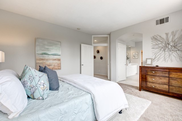 24 Silveroak Irvine, CA 92620 - Photo 35 of 49 a bedroom with a bed and a dresser