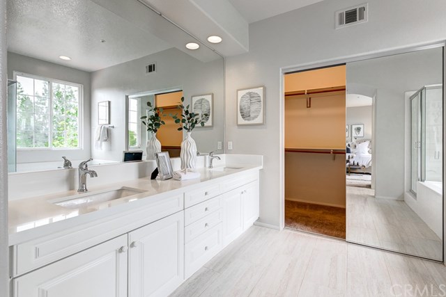 24 Silveroak Irvine, CA 92620 - Photo 37 of 49 a bathroom with a double vanity sink mirror and double