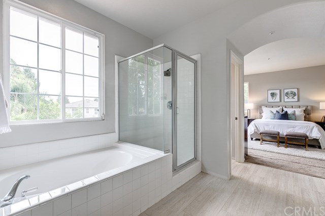 24 Silveroak Irvine, CA 92620 - Photo 38 of 49 a spacious bedroom with a bed and a window