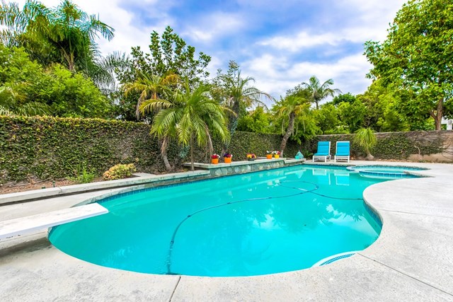 24 Silveroak Irvine, CA 92620 - Photo 41 of 49 a view of a swimming pool with a yard