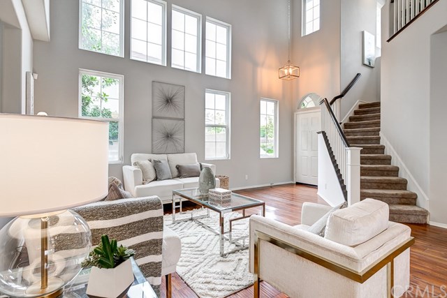 24 Silveroak Irvine, CA 92620 - Photo 6 of 49 a living room with furniture and a potted plant