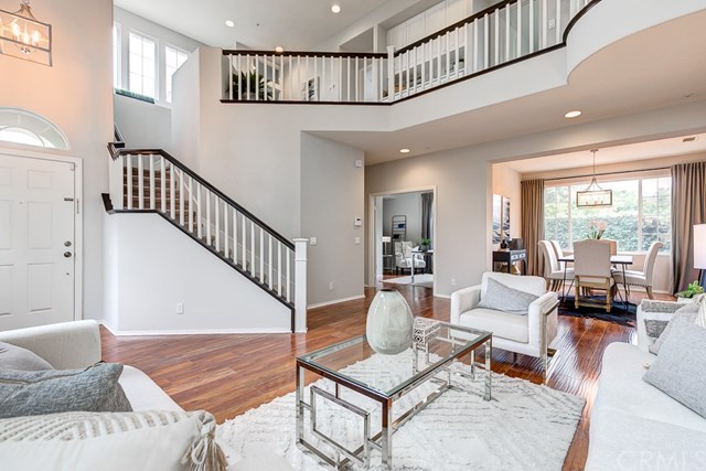 24 Silveroak Irvine, CA 92620 - Photo 8 of 49 a living room with furniture and wooden floor