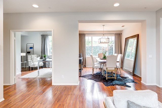 24 Silveroak Irvine, CA 92620 - Photo 9 of 49 a living room with furniture and a wooden floor