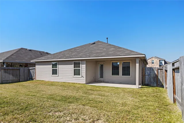a house with yard in front of it